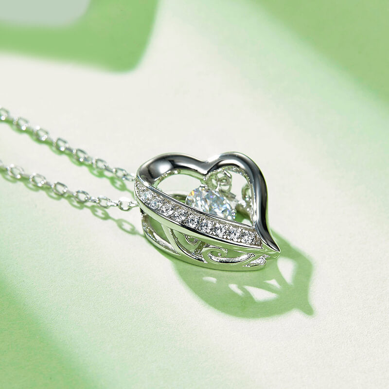 Dancing Moissanite Heart-Shaped Side Stone Necklace in Sterling Silver