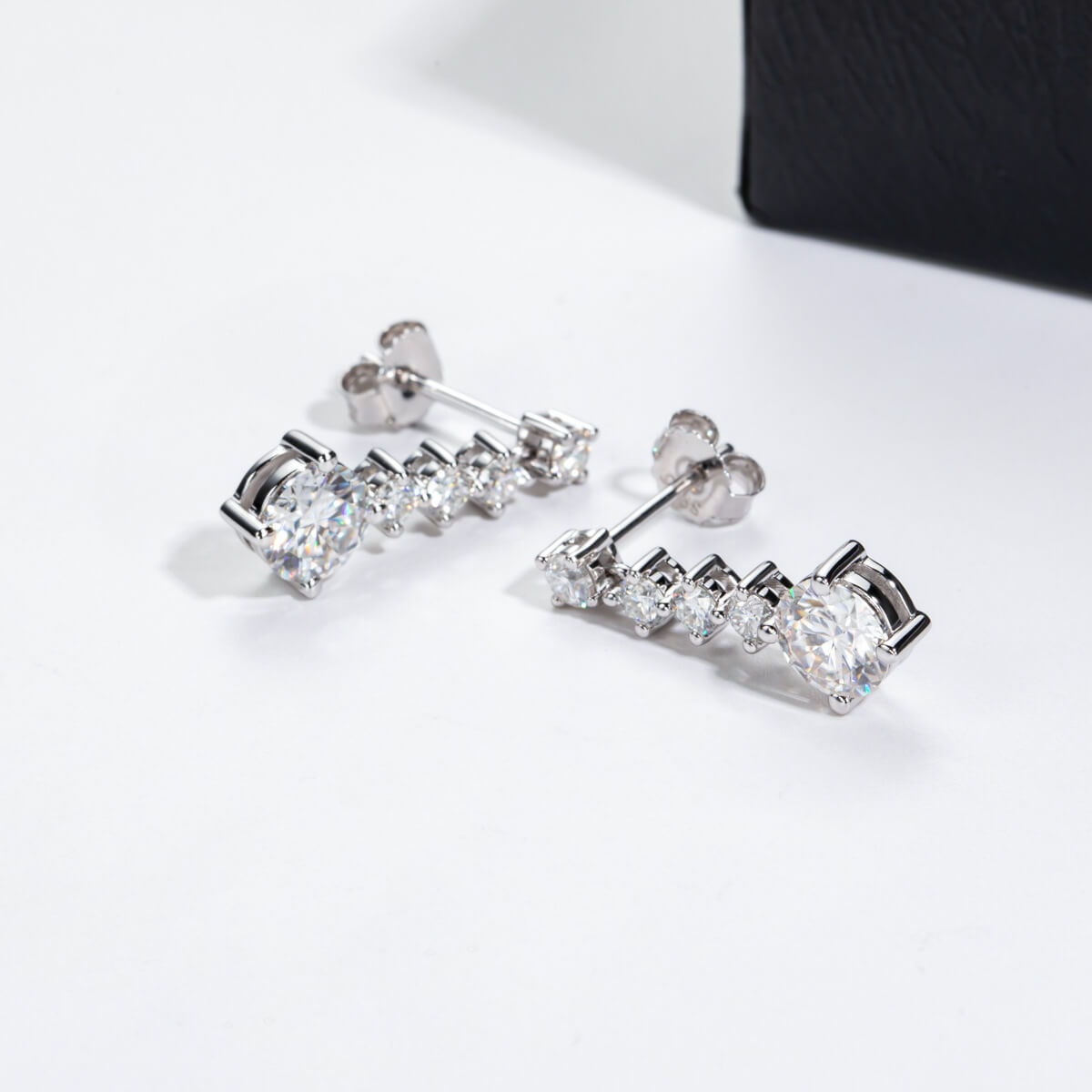 Graduated Linear Moissanite Drop Earrings In Sterling Silver